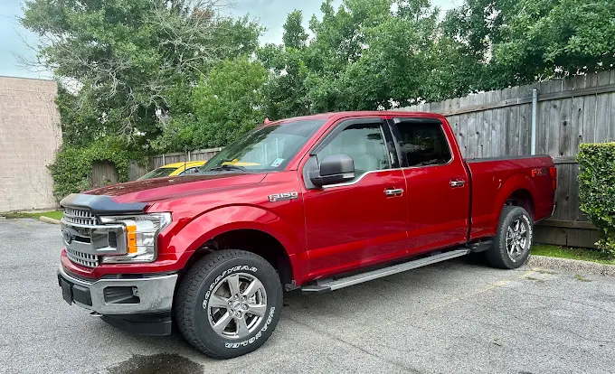 Red Ford F-150 after collision repair
